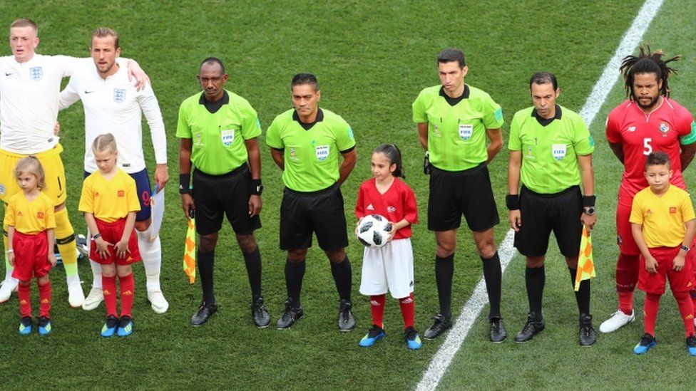 Alysia, from Huddersfield, with officials and players before the FIFA World Cup Group G match between England and Panama at the Nizhny Novgorod Stadium, Russia, on 24 June