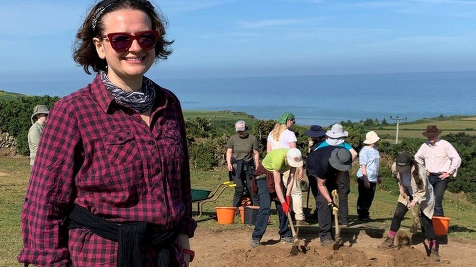 Rachael Crellin in front of part of the excavations