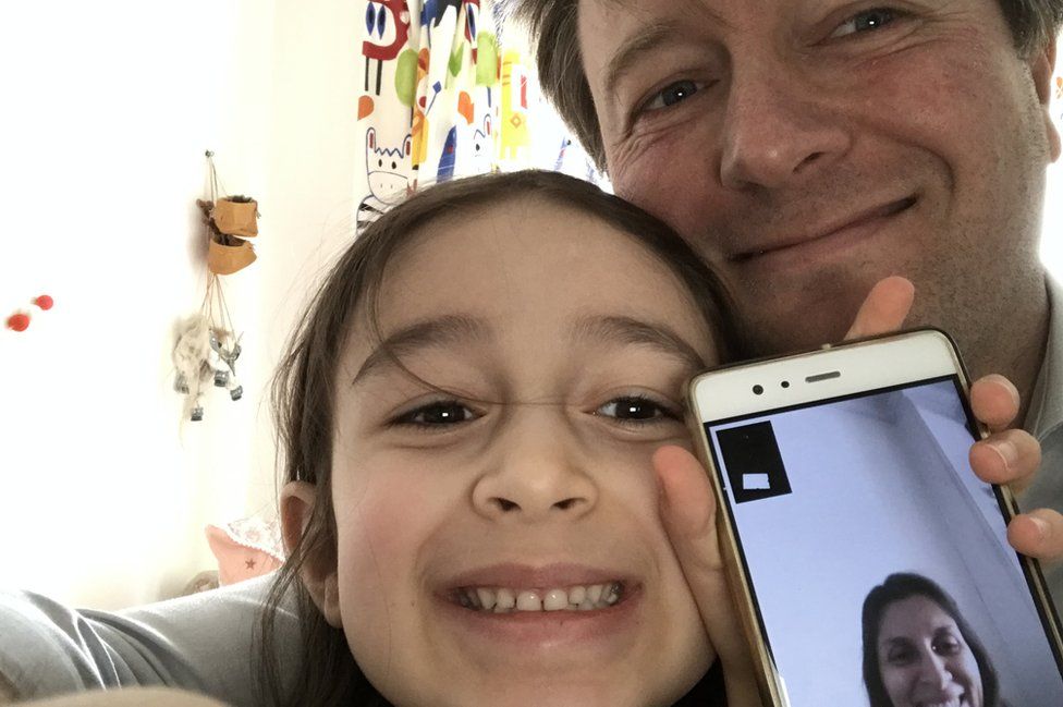 Richard Ratcliffe and his daughter on the phone of Nazanin Zaghari-Ratcliffe, April 11/12, 2020.