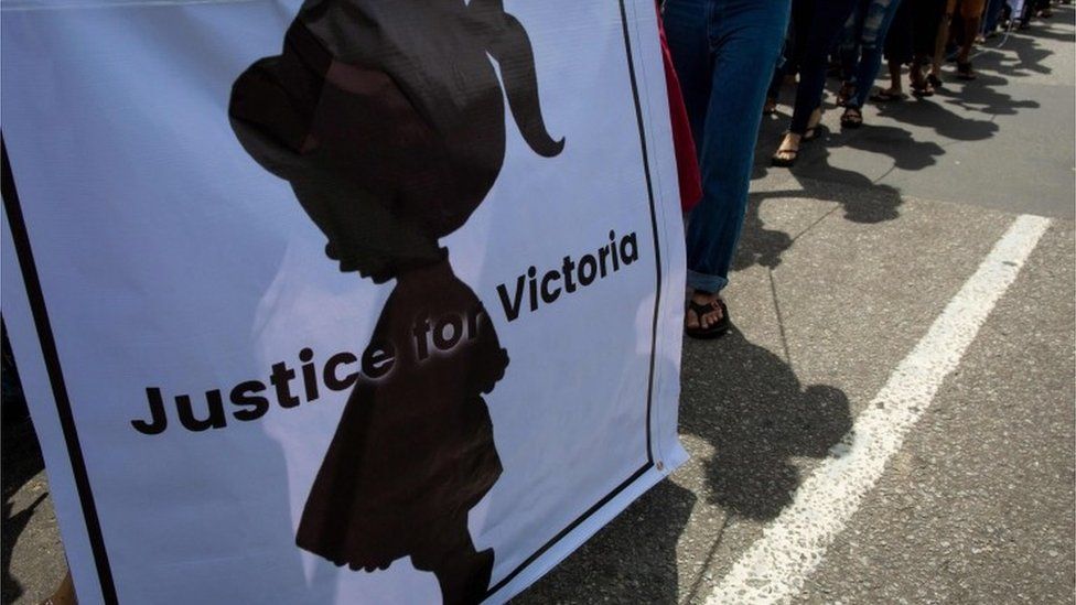 Protesters walk to the Central Investigation Department (CID) during the demonstration demanding justice for a two-year-old who was raped and given the pseudonym "Victoria" in Yangon on July 6, 2019.