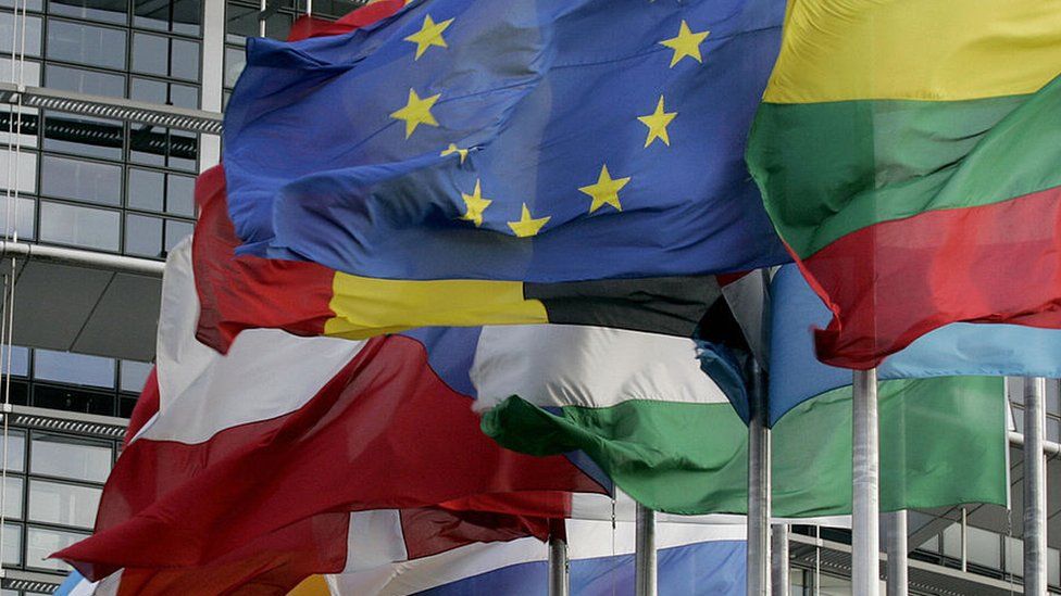 EU flag and national flags are hoisted in front of the European Parliament in Strasbourg