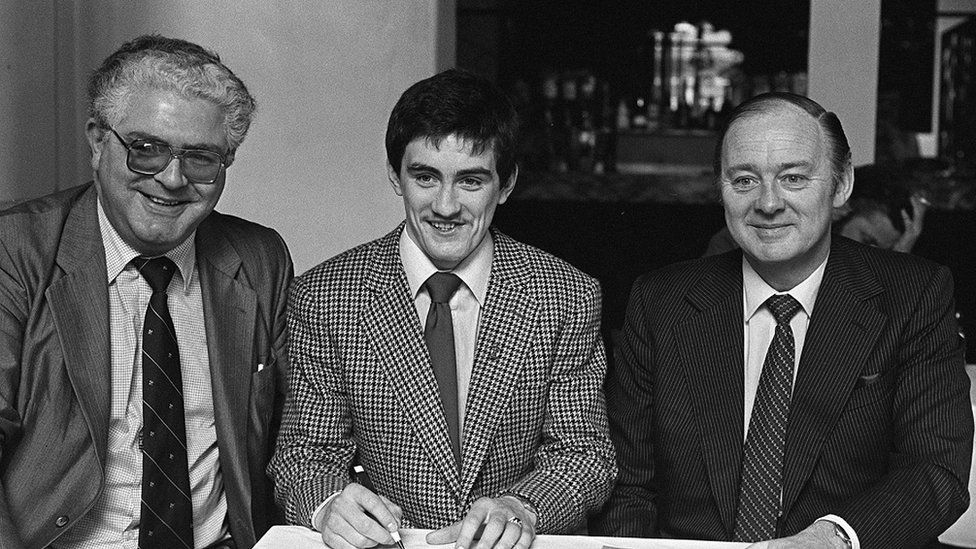 Barry McGuigan signing professional forms with Barney Eastwood in 1981