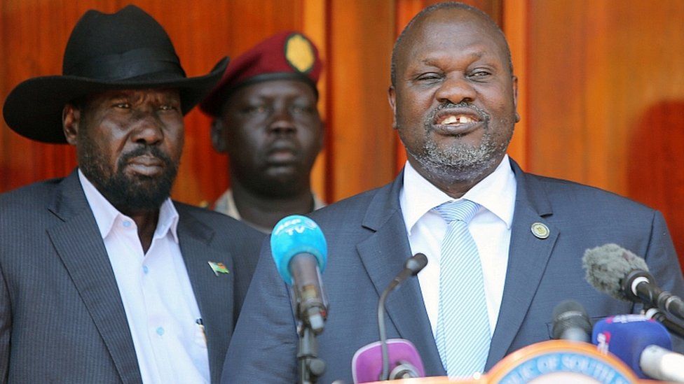 Former rebel leader Riek Machar (r)flanked by President Salva Kiir address a news conference at the State House in Juba, South Sudan February 20, 2020