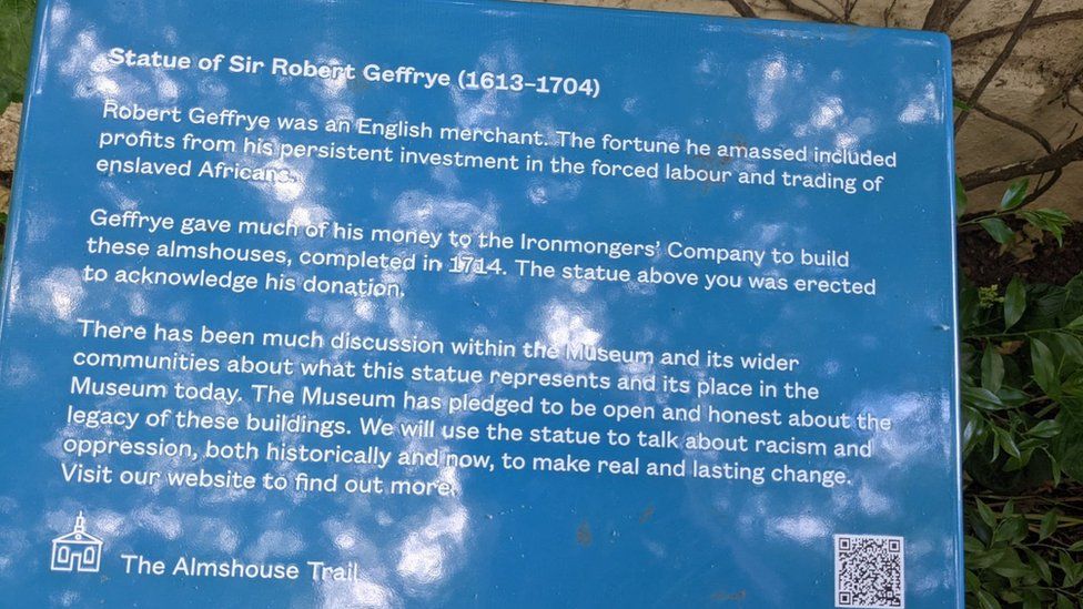 Plaque from the Almshouse Trail, acknowledging the controversial nature of the statue