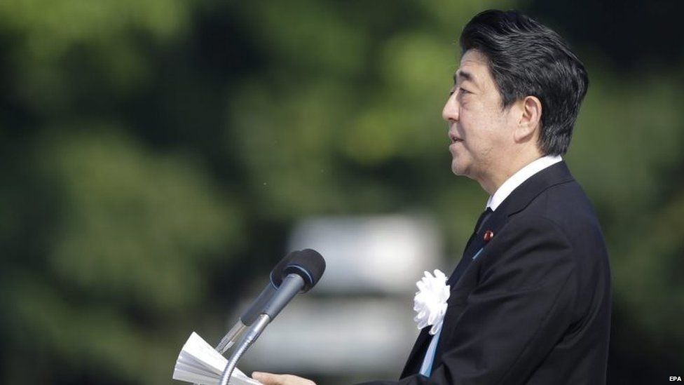 Japanese Prime Minister Shinzo Abe delivers a speech during the peace memorial ceremony marking the 70th anniversary of the nuclear bombing of the city at Hiroshima Peace Memorial Park
