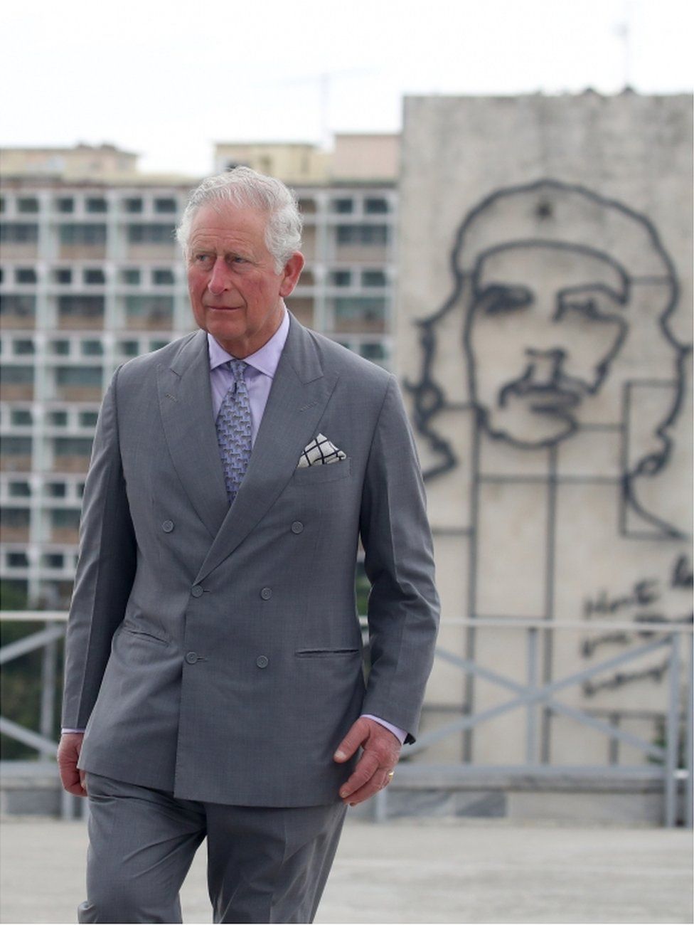 Prince Charles stands near an image of Ernesto "Che" Guevara