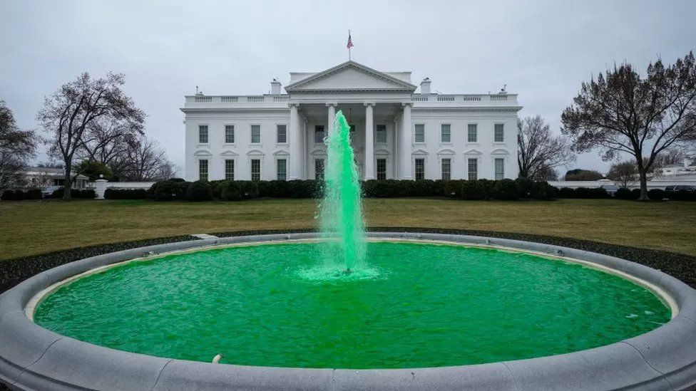 A fountain outside the White House pumps green water for St Patrick's Day