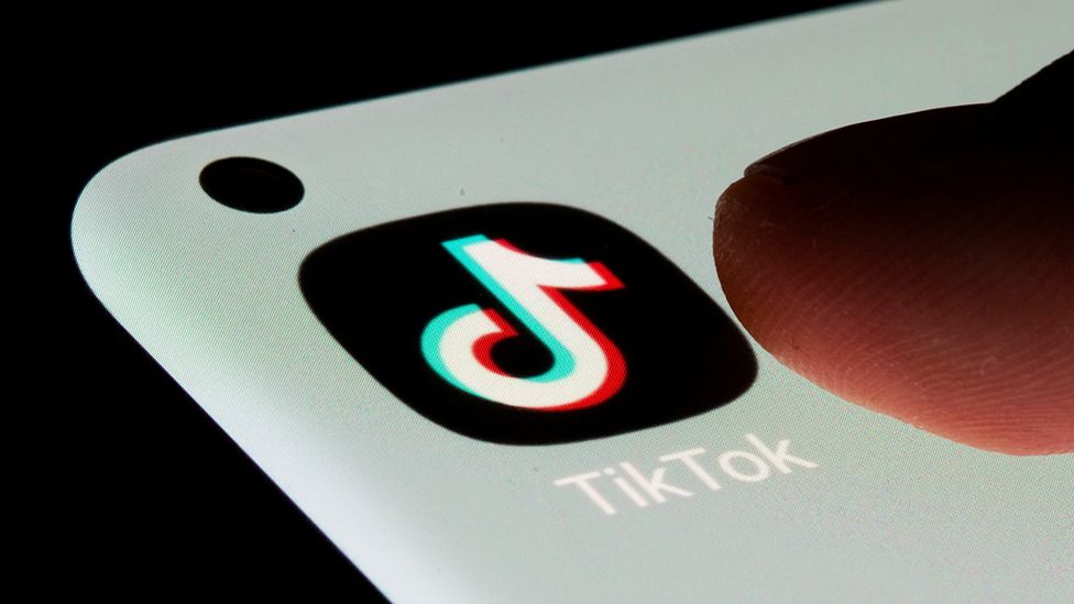 TikTok logo on phone