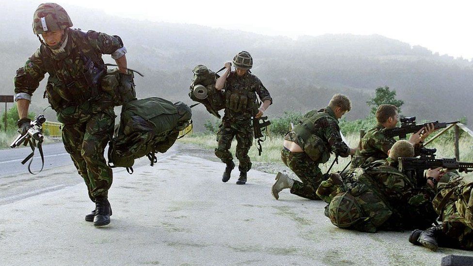 British soldiers running on duty in Kosovo in 1999
