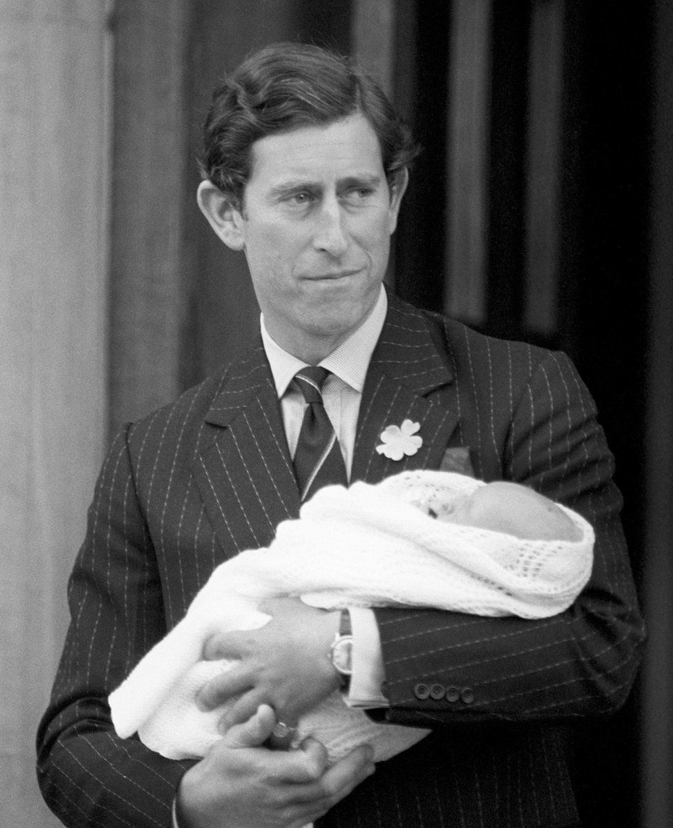 Prince of Wales, holds his newborn son Prince William as they leave St Mary's Hospital, Paddington, London