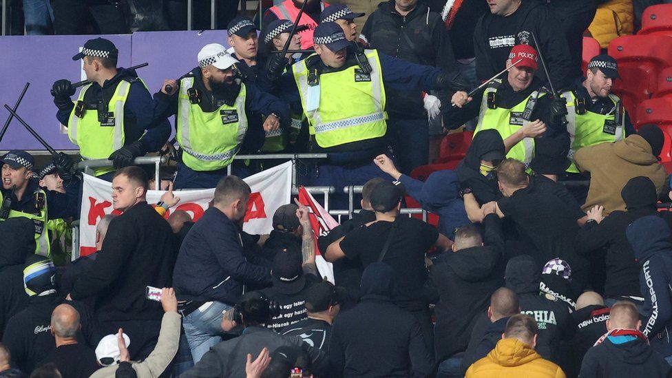 Fans clashed with stewards and police early in the game