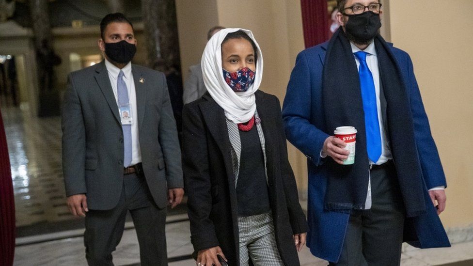 Democratic Congresswoman from Minnesota Ilhan Omar (C) walks to the House floor from her office inside the US Capitol in Washington, DC, USA, 12 January 2021.