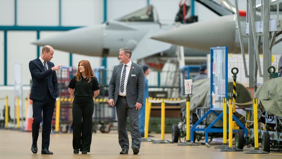 Prince William visiting an aircraft hangar