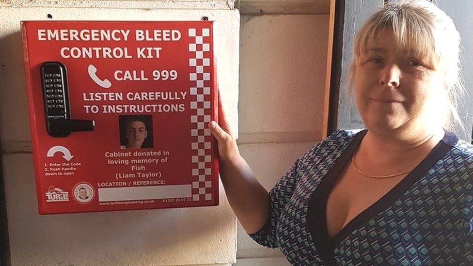 Julie Taylor with a bleed control kit installed outside a pub
