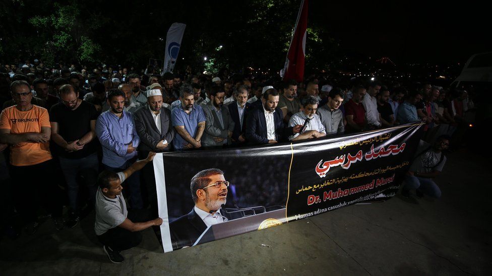 People perform funeral prayer in absentia for former Egyptian President Mohamed Morsi