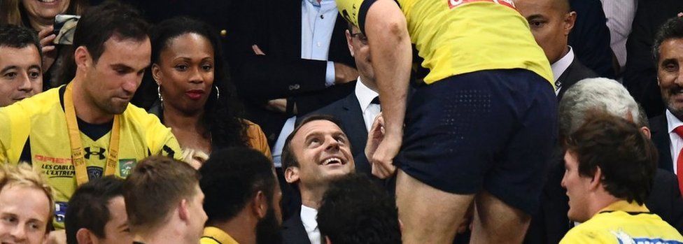 French President Emmanuel Macron congratulates Clermont's rugby players on June 4, 2017 at the Stade de France in Saint-Denis, outside Paris