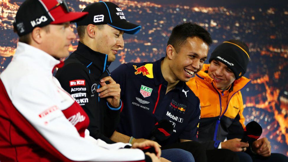 George Russell, Alex Albon and Lando Norris crack up in a press conference. F1 veteran Kimi Räikkönen (far left) is not known for smiling. Ever.