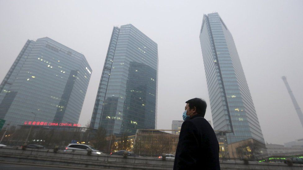 Man waits for a taxi amid Beijing smog - 28 November