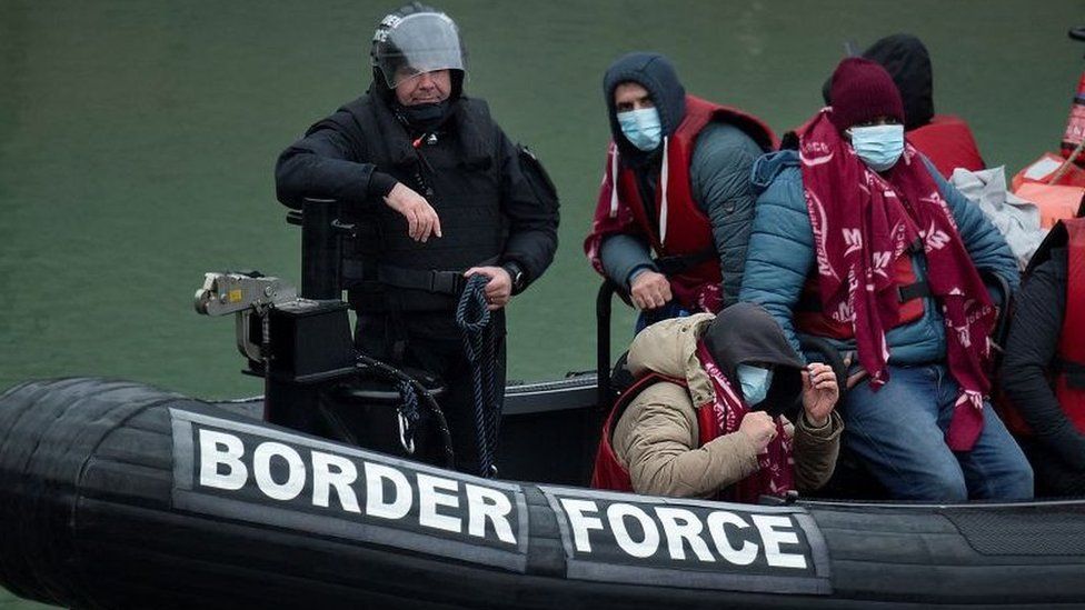 A UK Border Force patrol boat carries migrants picked up at sea on arrival at the Marina in Dover
