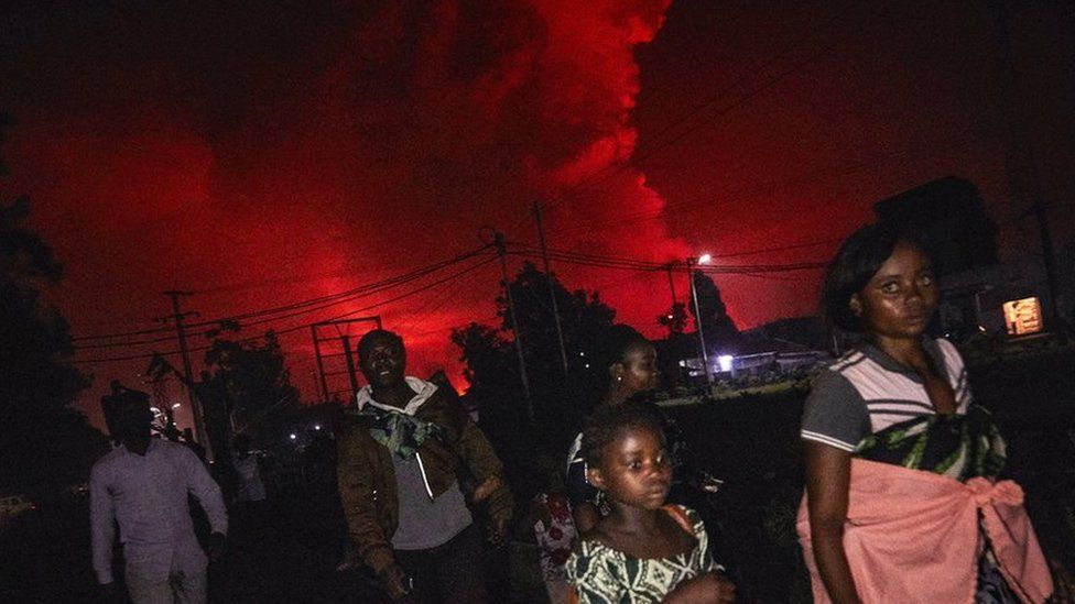 Congolese residents of Goma flee from Mount Nyiragongo volcano as it erupts over Goma