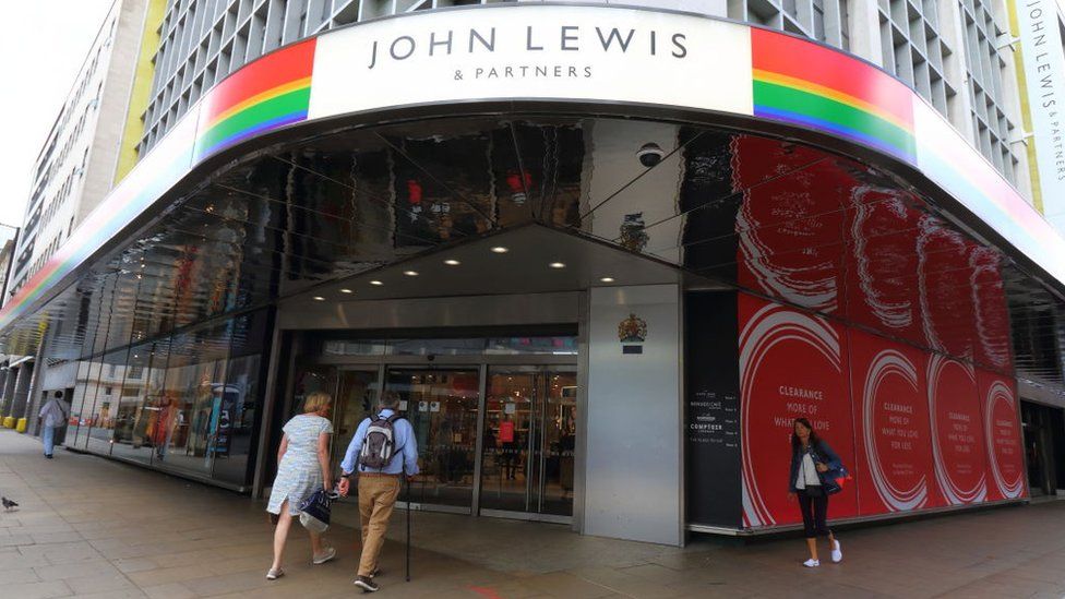 Two people walk in to a John Lewis