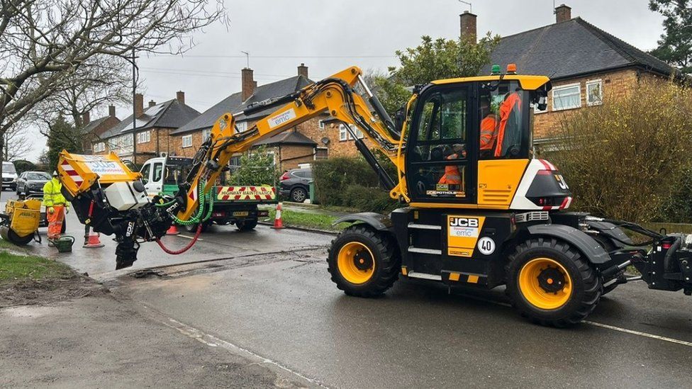 Pothole machine at work in a residential road