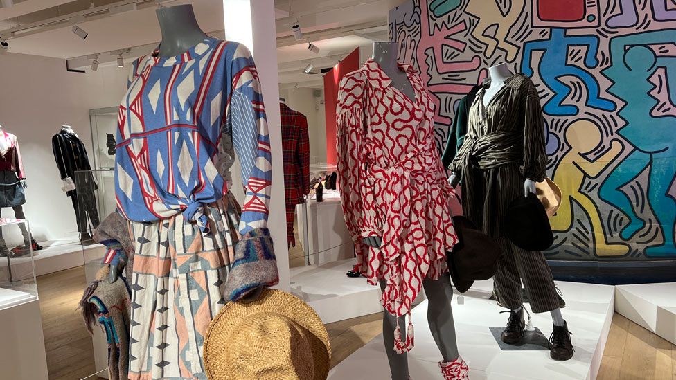 Three mannequins wearing colourful Vivienne Westwood clothes at Northampton Gallery