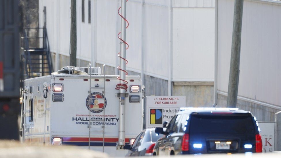 Police and fire officials outside the Prime-Pak Foods Inc. food packing plant following a reported chemical leak which officials indicate has killed multiple workers and sent many more to the hospital in Gainesville, Georgia, USA, 28 January 2021