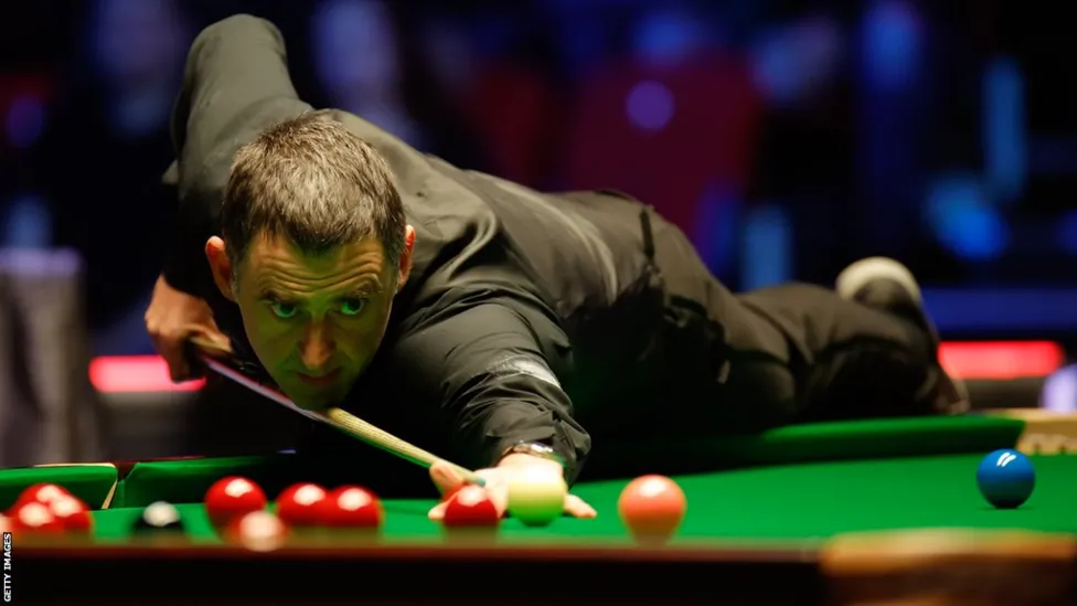 Snooker Showdown: Ronnie O'Sullivan Secures World Grand Prix Crown with 10-7 Win against Judd Trump.
