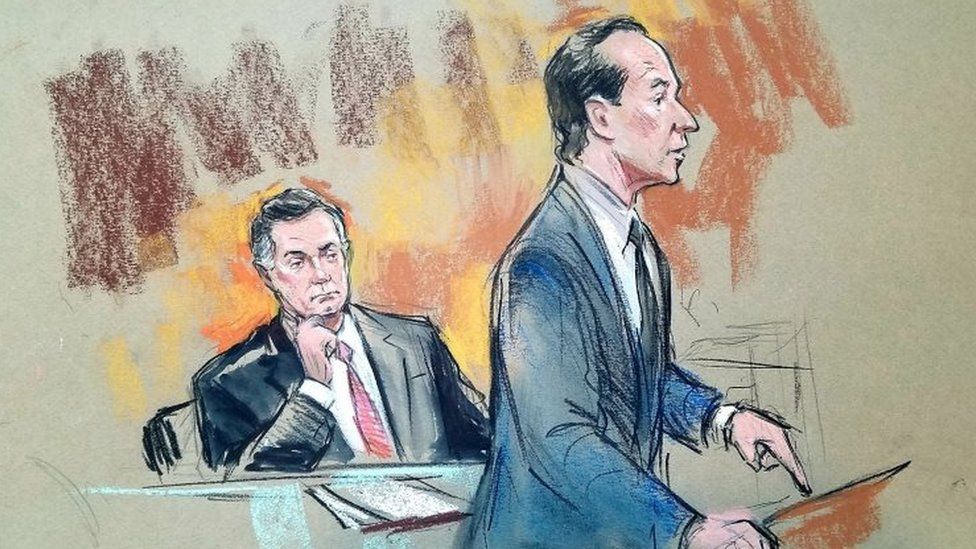 Paul Manafort seated (L) as his attorney speaks in court.
