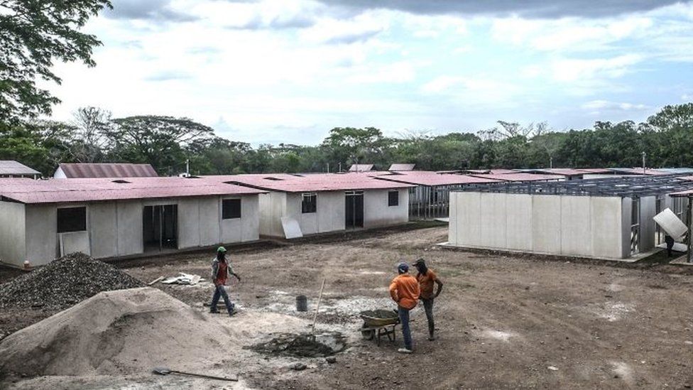 Farc guerrillas and civilians work in the construction of the accommodation where they will stay before the final disarmament, in the Transitional Standardization Zone in Pondores, La Guajira department, Colombia (05 April 2017)