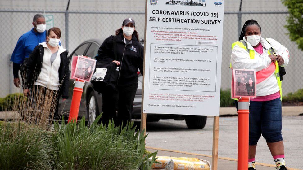 Workers leave Ford's Chicago Assembly Plant on May 20, 2020 in Chicago, Illinois. On Tuesday, one day after reopening the assembly plant, Ford temporarily shut down the facility after two employees tested positive for the coronavirus COVID-19