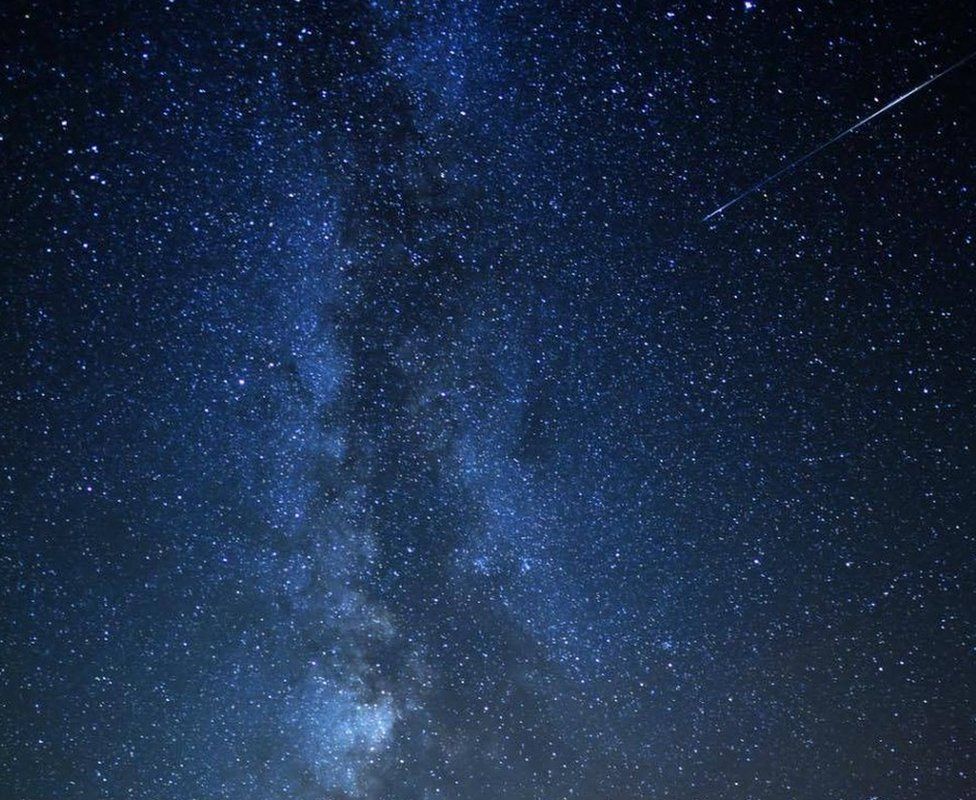 The Milky Way with the trail of a meteor or "shooting star"