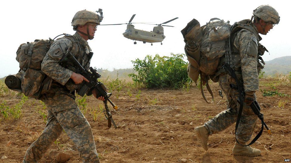 US army soldiers disembark from a C-47 Chinook helicopter during a training exercise in the Philippines - 20 April 2015