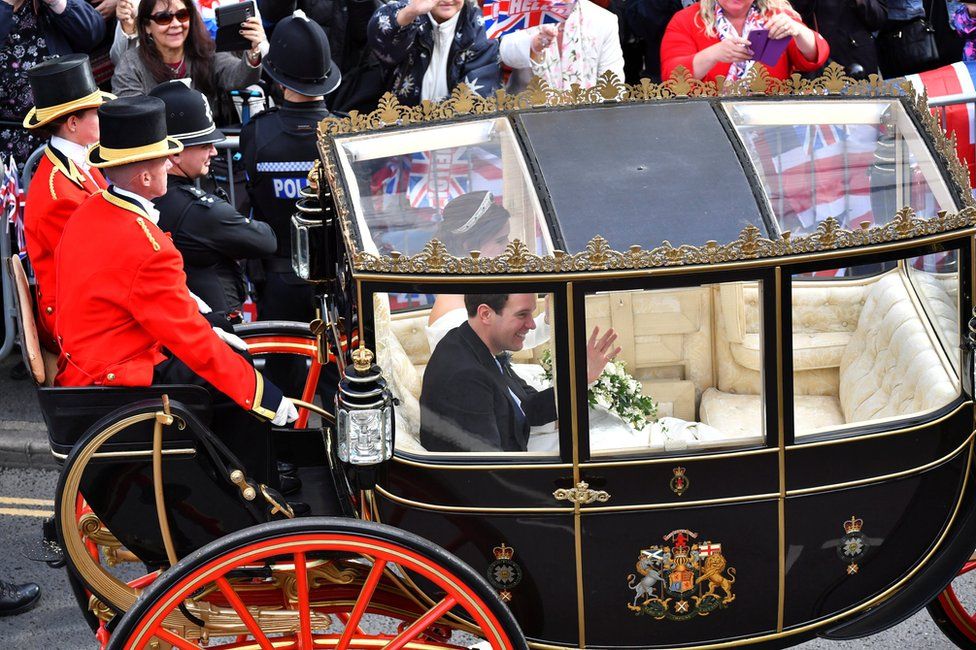 Princess Eugenie of York and her husband Jack Brooksbank leave in a carriage