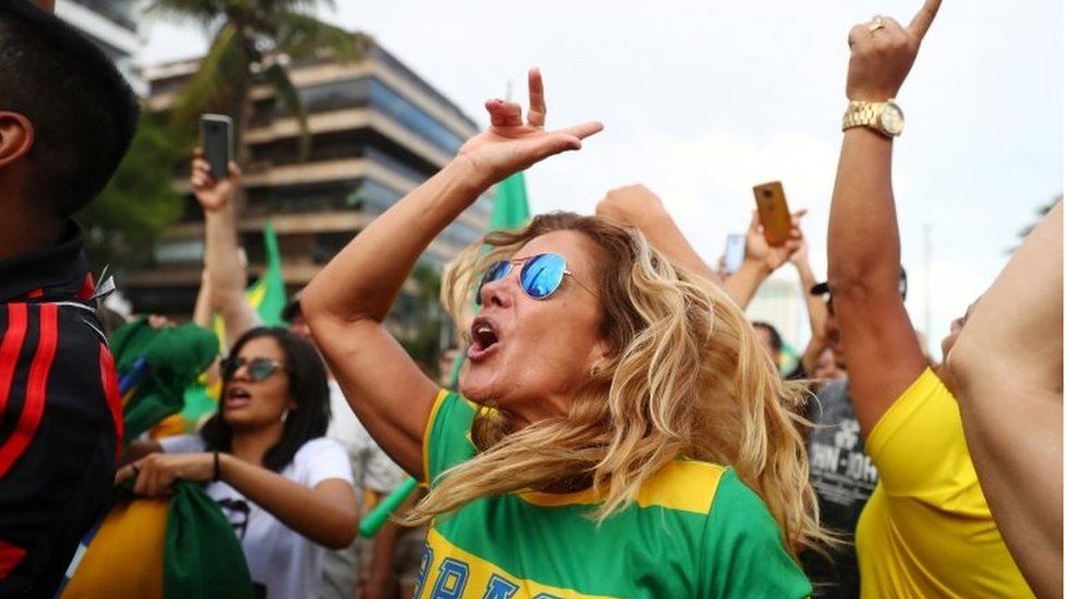 Supporters of Jair Bolsonaro cheer in Rio