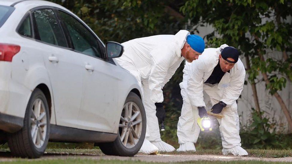 A police forensics team investigates a crime scene after multiple people were killed and injured in a stabbing spree in Weldon, Saskatchewan, Canada. September 4