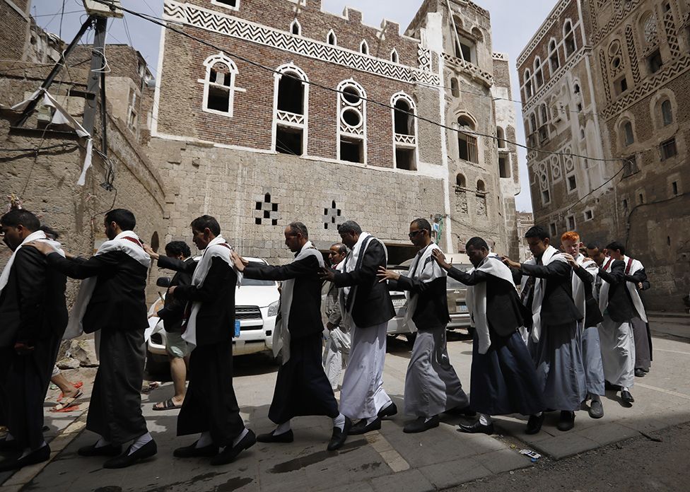 Blind grooms attend a mass wedding ceremony in the Sanaa, Yemen