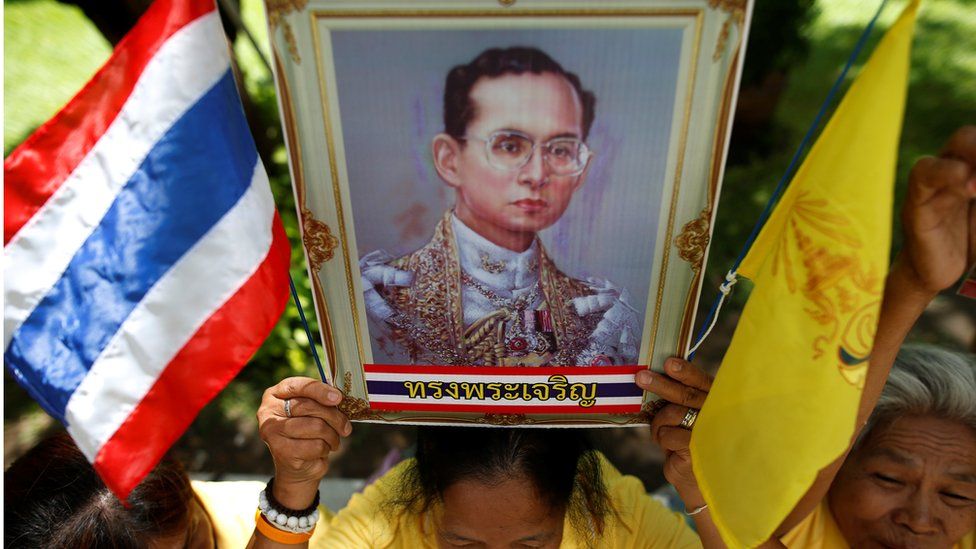 Well-wishers hold a picture of Thailand"s King Bhumibol Adulyadej at the Siriraj hospital where he is residing, in Bangkok, Thailand, June 9, 2016.