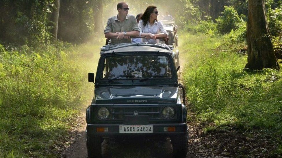 Britain's Prince William (left) and Kate Duchess of Cambridge take an open vehicle safari inside the Kaziranga National Park in India's north-eastern state of Assam