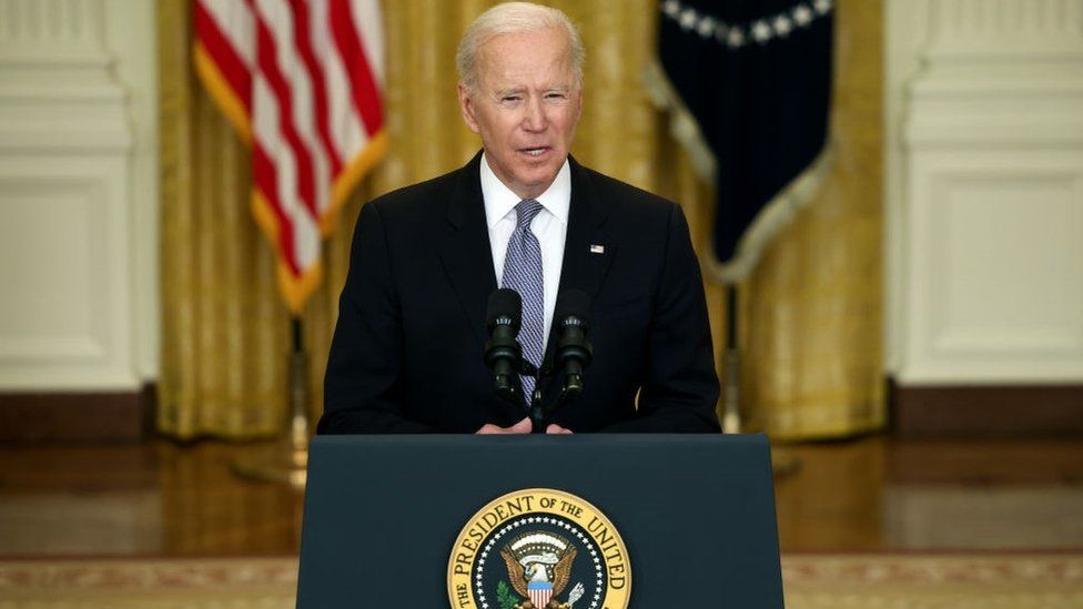 Joe Biden gives an update on his administration's COVID-19 response and vaccination program in the East Room of the White House