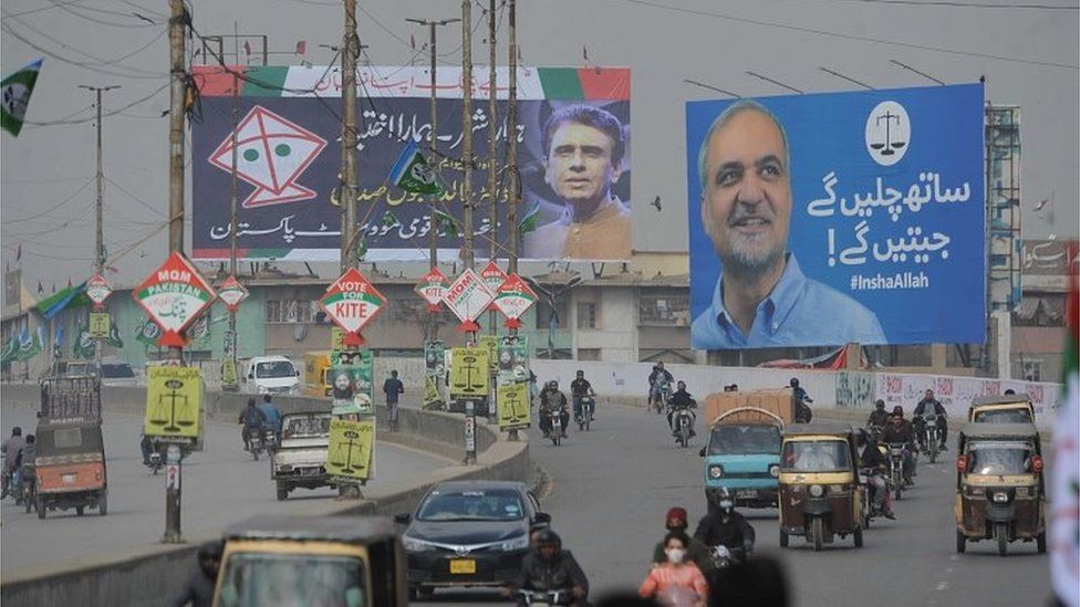 Electoral posters of political parties Jamaat-e-Islami (scales) and Muttahida Quami Movement Pakistan (MQM-P) (kites) are displayed ahead of general elections in Karachi, Pakistan, 06 February 2024.