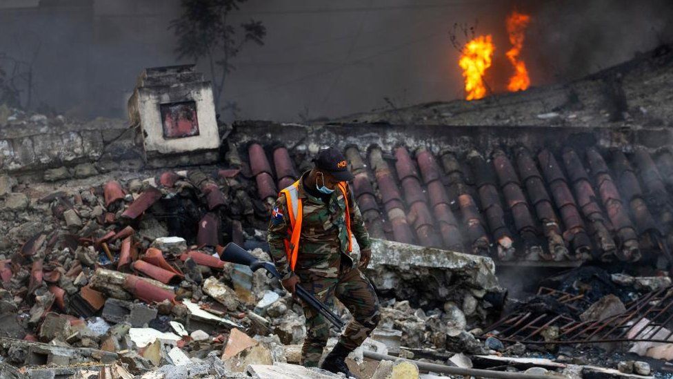 A member of Dominican Army walks at the site of the explosion in San Cristabal, some 30km from Santo Domingo, Dominican Republic - 14 August 2023.