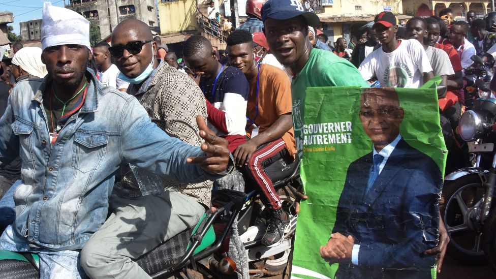 Supporters of Cellou Dalein Diallo on motorbikes in Guinea