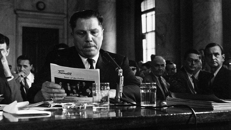 Jimmy Hoffa reading in a packed room