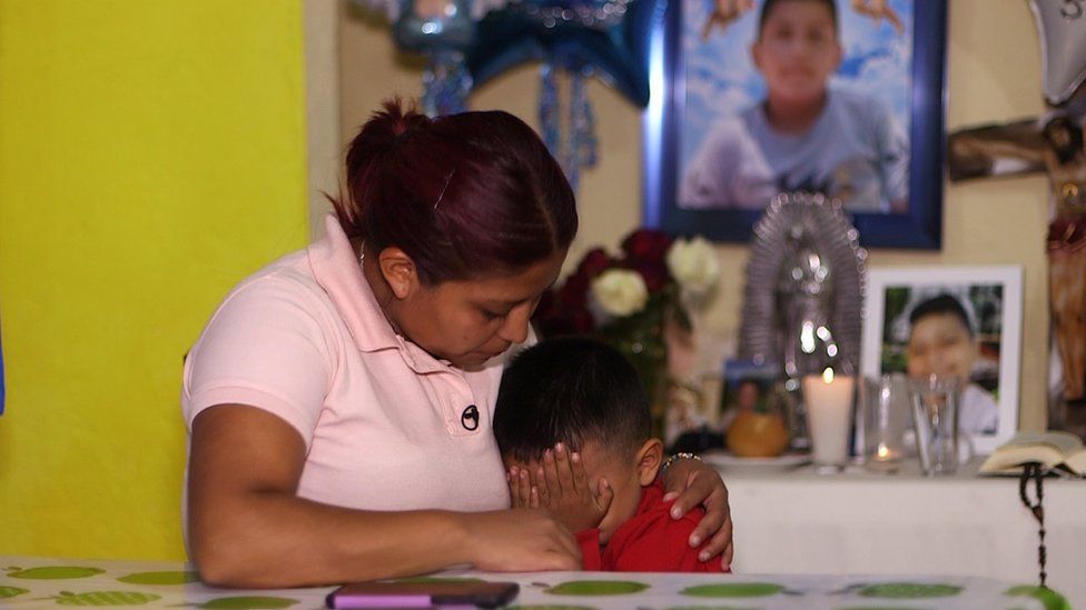 Marisol Tapia comforting her younger son