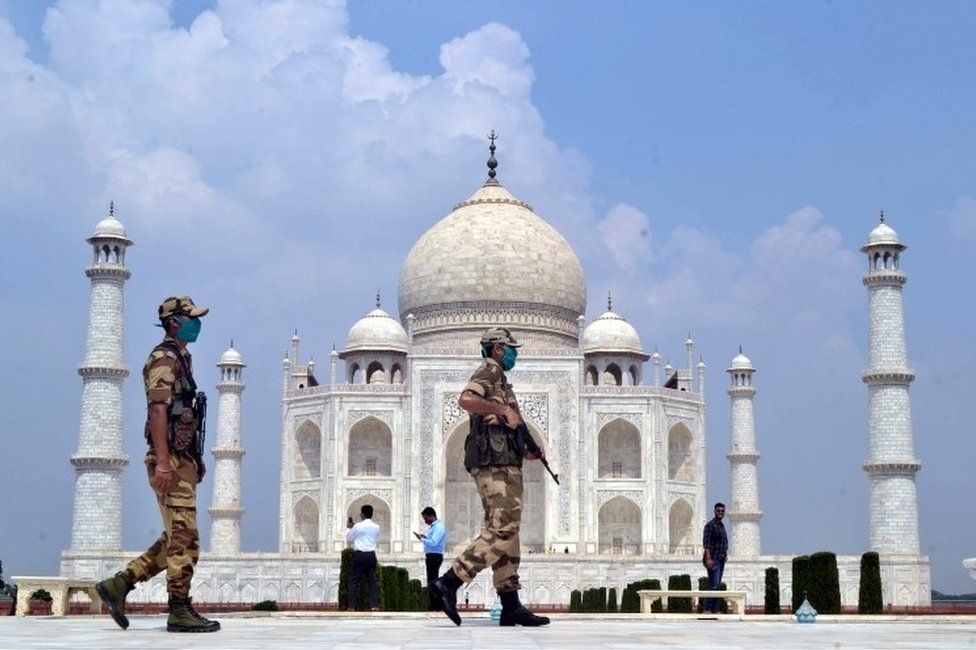 Indian security personnel stand guard at the Taj Mahal in Agra, Uttar Pradesh, India, 21 September 2020