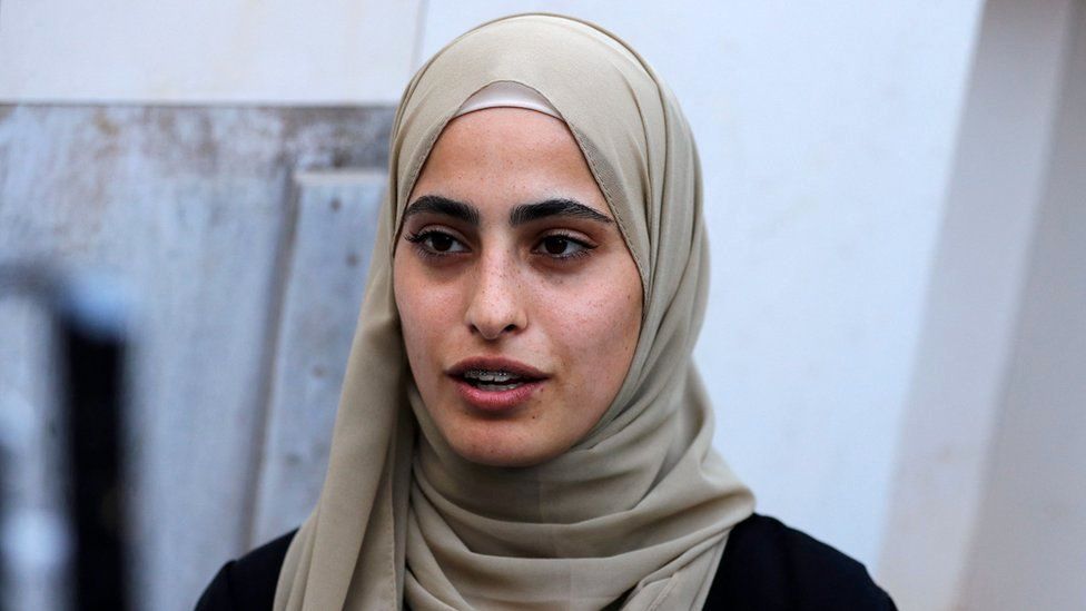 Palestinian activist Muna el-Kurd, 23, talks to reporters at home in the neighbourhood of Sheikh Jarrah in Israeli-annexed east Jerusalem after being released from an Israeli police station, 6 June 2021