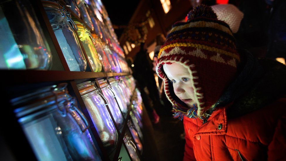 A youngster enjoys the Sugarcube light display