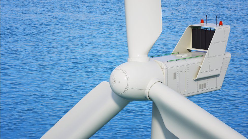 Industrial wind turbine close up in sea